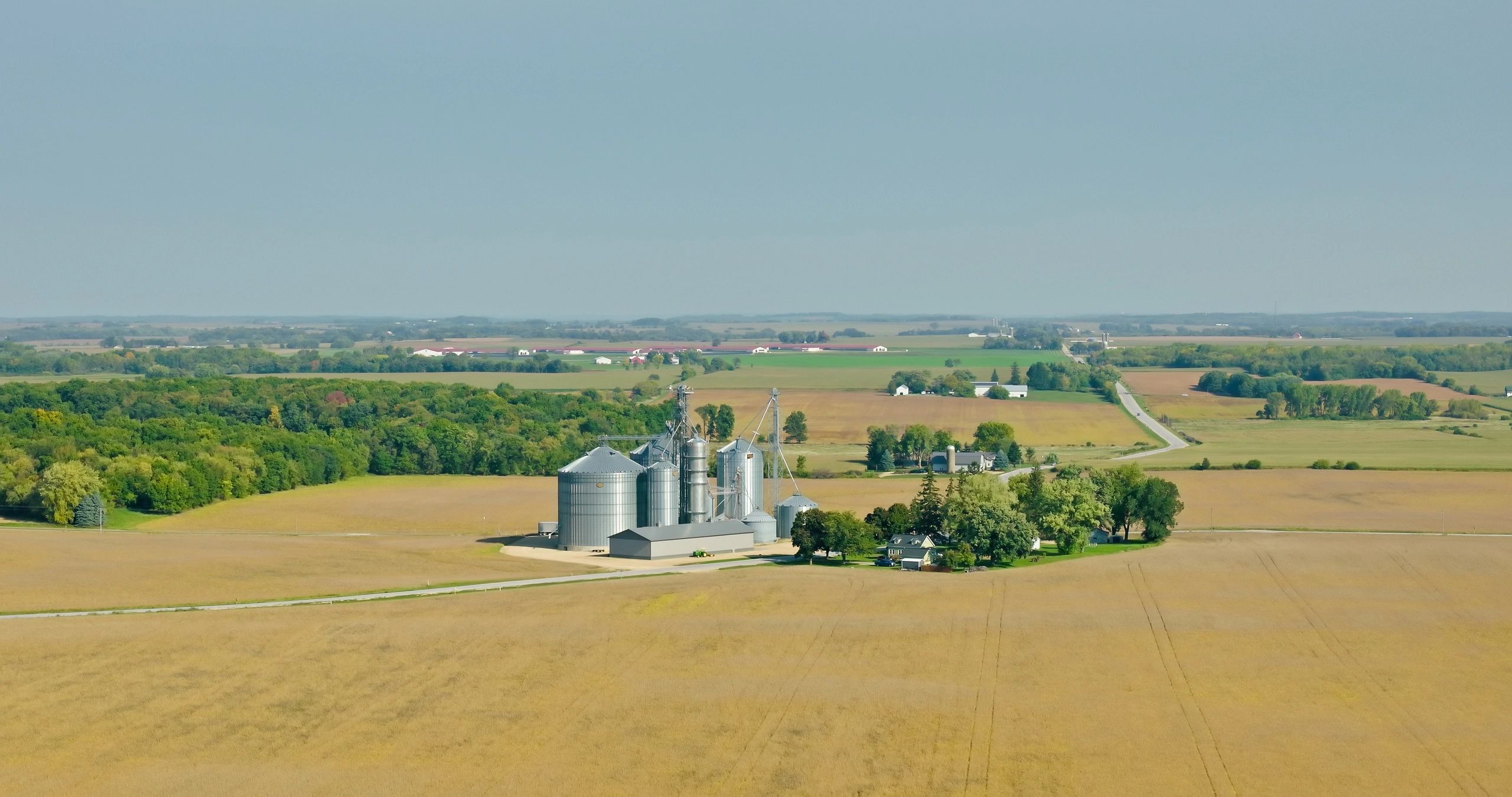Aerial view of sustainable farmland and grain silos